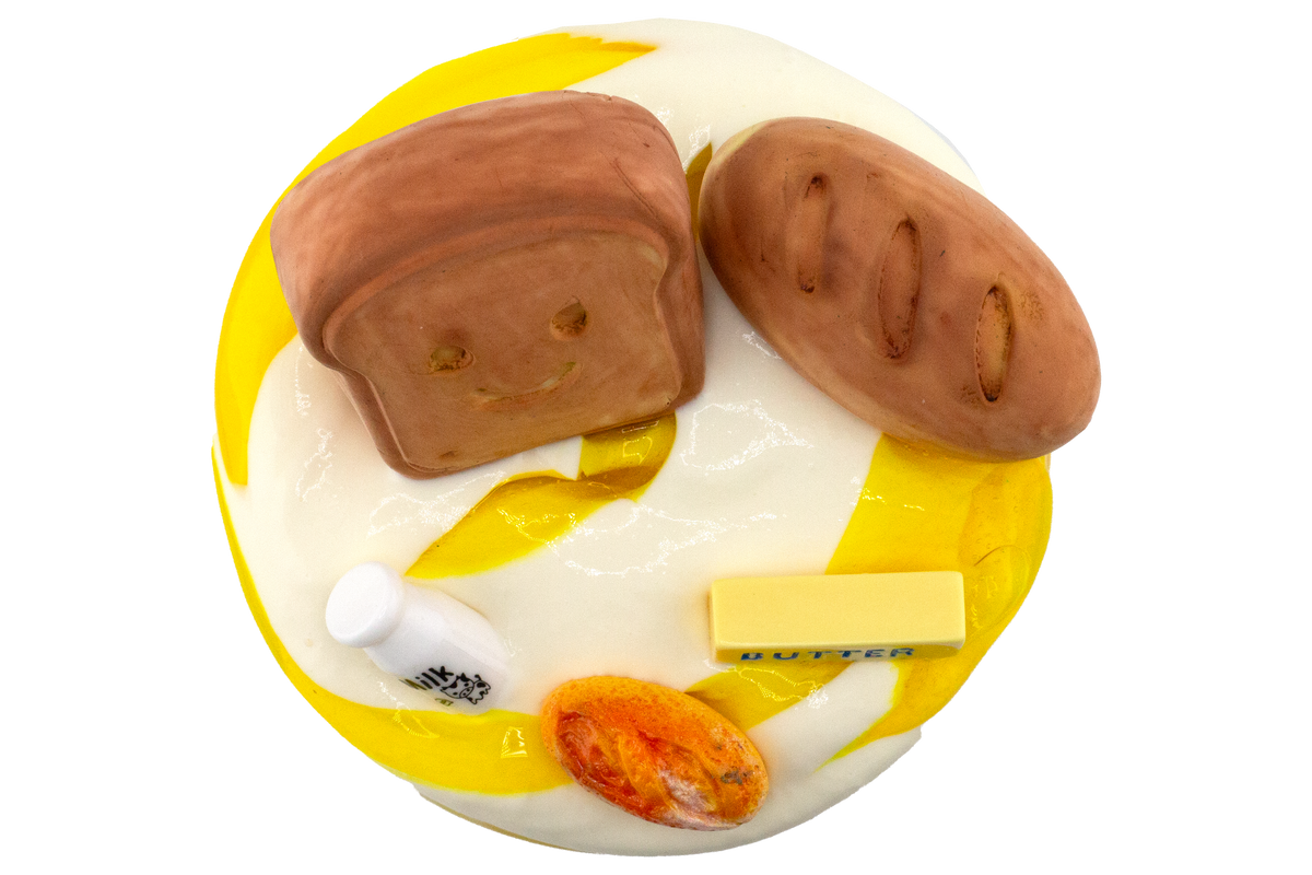 A Loaf of Bread, A Container of Milk and a Stick of Butter